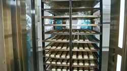 Women Pushing Baking Rack at Confectionery Stock Footage