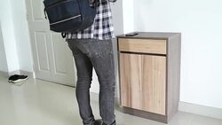 Young man going out Stock Footage