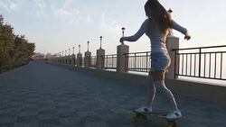 Young stylish attractive woman skateboarding at sunrise on seafront, slow motion Stock Footage