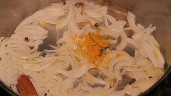 Fried onion with yellow Indian herbs powder with cooking oil in Slow motion. Stock Footage