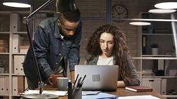 Multi-Ethnic Young Business Professionals Working in Night Office Stock Footage