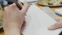 Business people working, taking notes in cafe Stock Footage