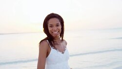Portrait of African American girl on beach vacation Stock Footage