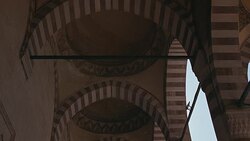 UP ANGLE OF STRIPED POINTED ARCHES AND CEILING. COULD BE SULEYMANIYE MOSQUE. ISLAMIC ARCHITECTURE. Stock Footage