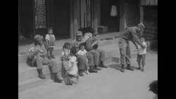 UN soldiers play with Korean war orphans News Clip