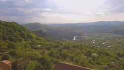 Beautiful rooftops of Bagrati Cathedral and amazing green landscape, Georgia Stock Footage