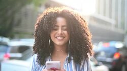 Young Girl Using Mobile Outdoors Stock Footage