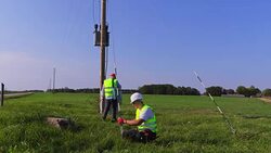 Two electricians perform transformer technical maintenance Stock Footage
