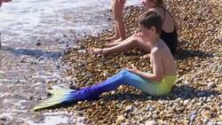 Mermaids make a splash in the sun News Clip