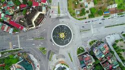 4K Aerial top view Circling Roundabout With Clocktower. Ha Long Bay, Halong City Stock Footage