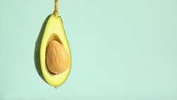 water or oils dropping on an avocado Stock Footage