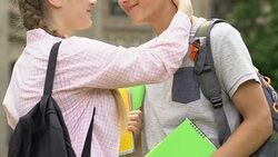Student couple nuzzling, short romantic love meeting on break near college Stock Footage