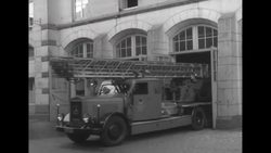 Humorous clip of German firemen rushing to fire only to find men puffing away on pipes and women smoking cigars News Clip