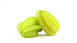 Two whole carambola fruits with water drops. Rotating on the turntable isolated on the white background. Close up. Macro. Stock Footage