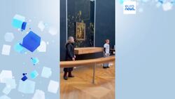 Climate activists throw soup at Mona Lisa painting in Louvre Museum News Clip