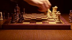 chess player making a move in the game on wooden table Stock Footage