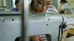 Young Woman Sewing Clothes with Machine Stock Footage