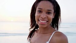 Portrait of African American female on ocean beach Stock Footage