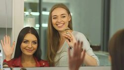 Beautiful girl does a hairstyle in a beauty salon Stock Footage