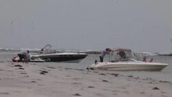 CLEAN : Boaters relax on Massachusetts shore as state bans boats from tying up together News Clip