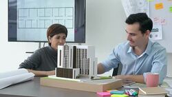 Architects male and Businesswoman are working on a building model. Business woman suggest idea to designer at modern office. concept of construction, architecture, development and creative. Stock Footage
