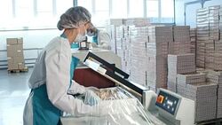 Woman Using Packaging Machine at Factory Stock Footage