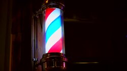close-up of a lighted barber pole spinning Stock Footage
