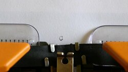 Close up footage of a person writing CRISIS on an old typewriter... Stock Footage