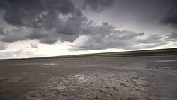 Storm clouds moving in over the Wadden sandflats in the Dutch Waddensea region in the North of The Netherlands. Stock Footage