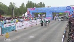 China hosts first-ever robots vs humans half-marathon in Beijing News Clip
