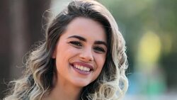 Portrait of girl smiling and laughing spontaneously to camera Stock Footage