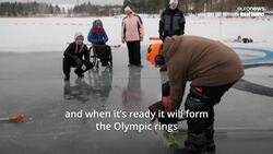 Finnish inventor builds spinning Olympic rings out of a frozen lake News Clip