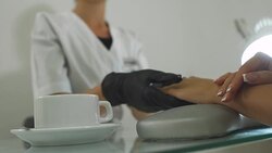 Charming girl in a manicure salon Stock Footage