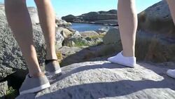 People walk among the coastal stones in Tjome nature Park, Norway Stock Footage
