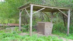 An old feeder for the wild boar in the forest Stock Footage