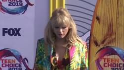 Taylor Swift makes a colorful entrance in Versace at the Teen Choice Awards in California News Clip