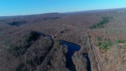 Aerial view of Pocono Mountains, Appalachian, in late fall sunny day. The Hickory River Stock Footage