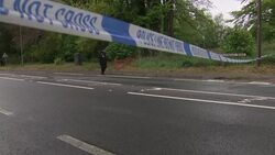 Police taape and closed road News Clip