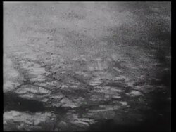 B-29 bombardment over Japan, civilians running for shelter, nighttime burning city Stock Footage