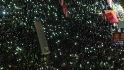 Protesters hold torchlight rally in Hong Kong Instructional Video