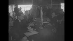 Allied negotiators and North Korean negotiators at table discuss Korean peace conference News Clip