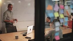 Staff in a late night team meeting Stock Footage