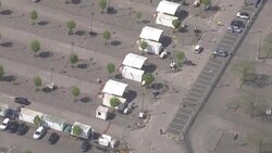 Aerials of coronavirus drive through testing centre News Clip