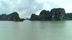 4k Aerial Over boats docked in bay with karst mountains. Ha long bay. Halong City. Stock Footage