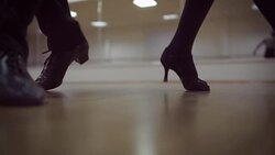 Dancing male and female legs in the dance studio Stock Footage
