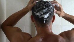 Sportive man taking shower after exhausting workout, perfect body, hair washing Stock Footage