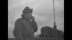 Soldiers in US Army tank; smoke from bomb News Clip