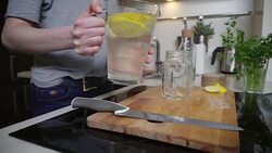 Young woman pouring lemonade Stock Footage