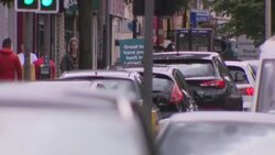 Busy Leicester shopping street with social distancing notices News Clip