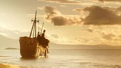 Rusty broken shipwreck on sea shore Stock Footage